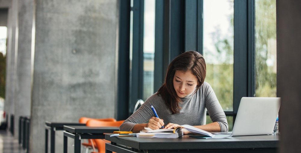 Shot,Of,Young,Asian,Female,Student,Sitting,At,Table,And jobs-fuer-schueler