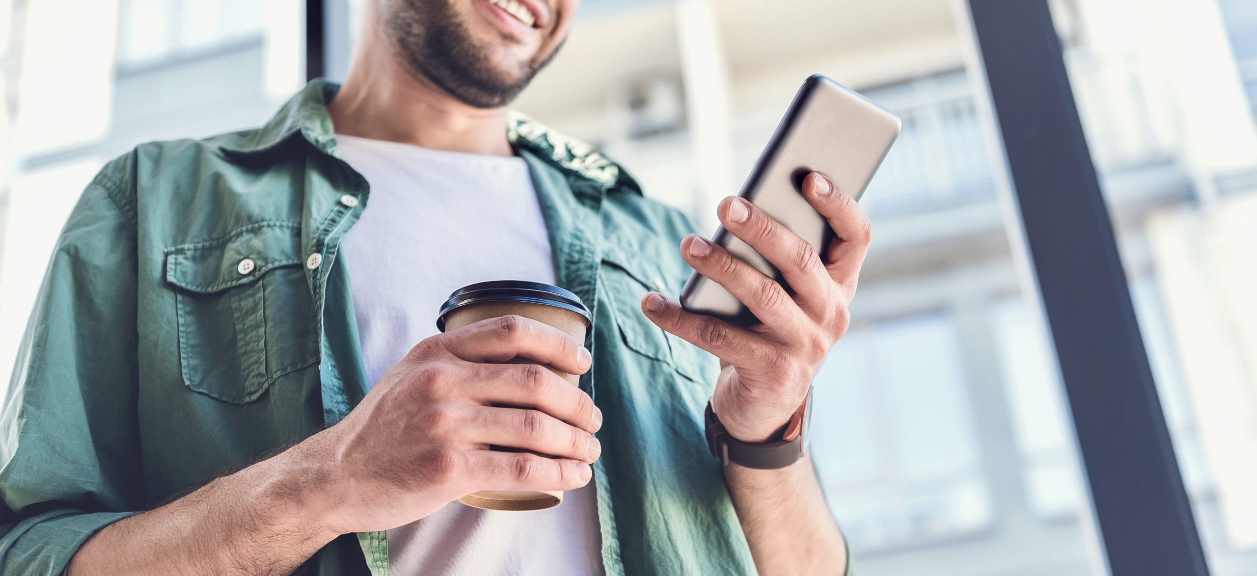 Happy,Adult,Guy,Is,Looking,At,Screen,Of,Mobile,Phone Cashback